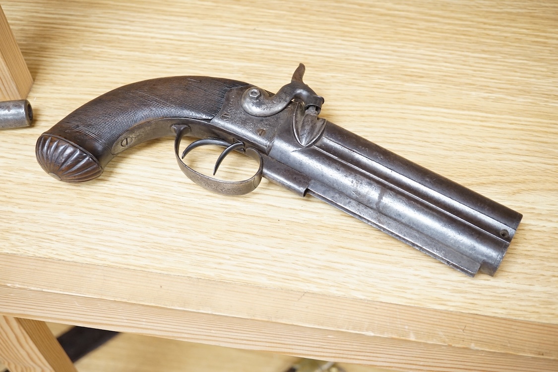 A double barrel over and under 16 bore percussion holster pistol by J. Beattie, barrels 14cm, London proofed, engraved; J. Beattie, Regent Street, London, with foliate engraved boxlock action and finely chequered walnut